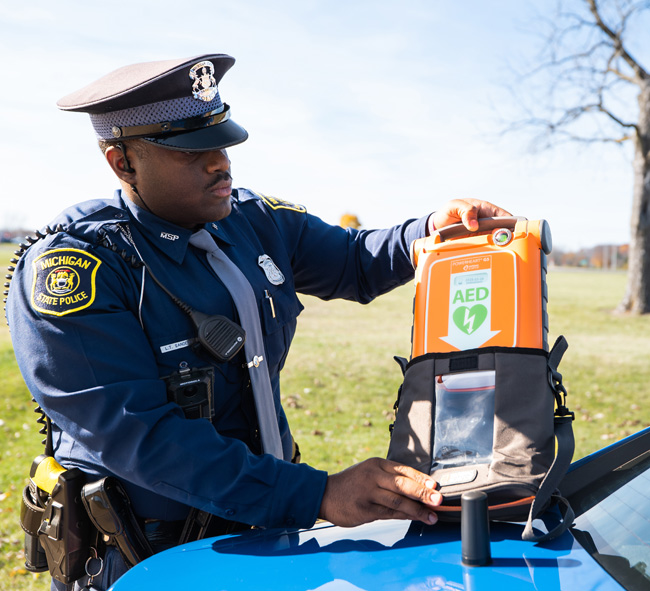 Michigan State trooper with new AED