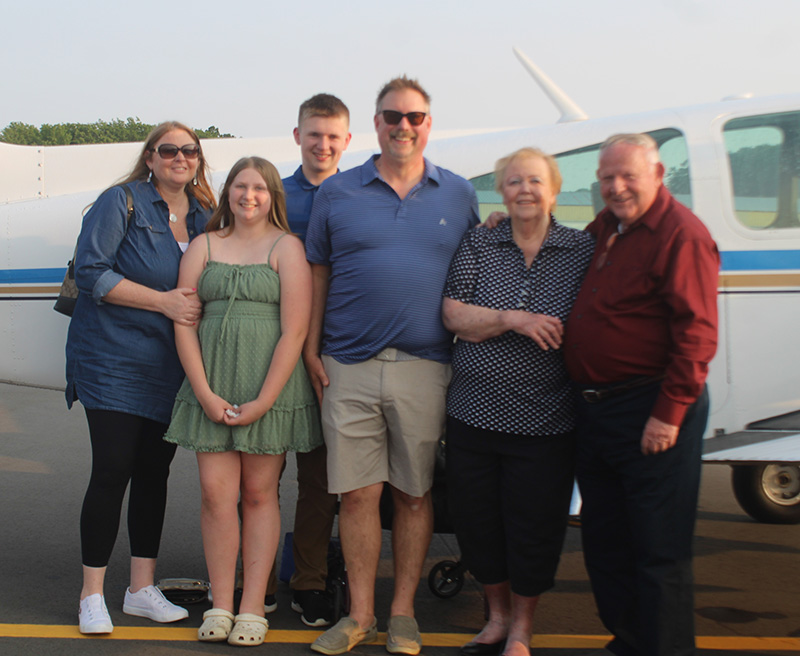 Carl Doherty and family in front of his aircraft