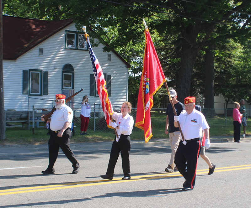 service members lead parade