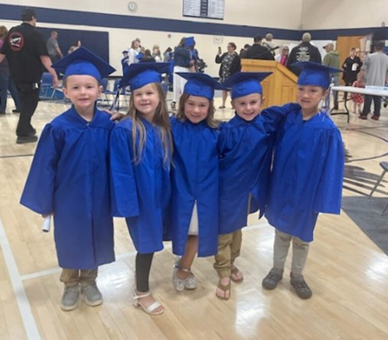 Hale kindergartners in graduation gowns and caps.