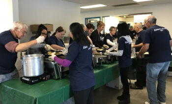 Volunteers serving a hot meal on Thanksgiving