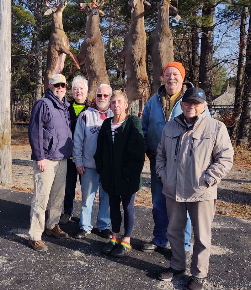 Group standing at Fred's Buck Pole in Roscommon