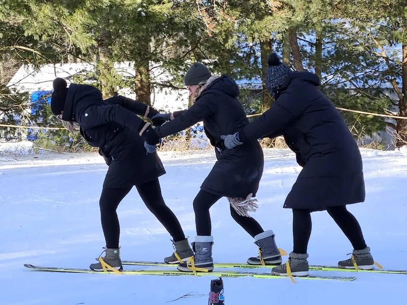 Three-person ski race