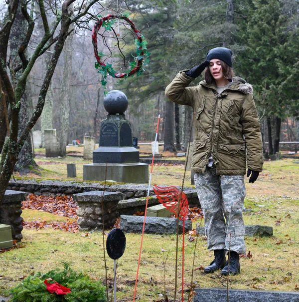 C/Amn Emma Brewer at grave of soldier