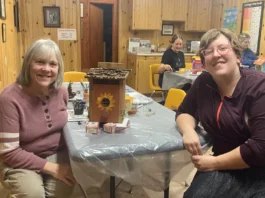 Two women posing with their Fairy House