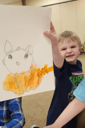 Curtis Benson showing off his fox drawing