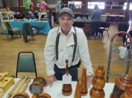 Mark Schmidt with wood crafts