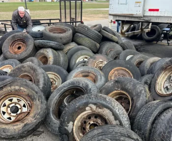 Scott Nestle piling old tires