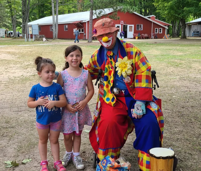 Hazel Lewis and Autumn Lewis with clown