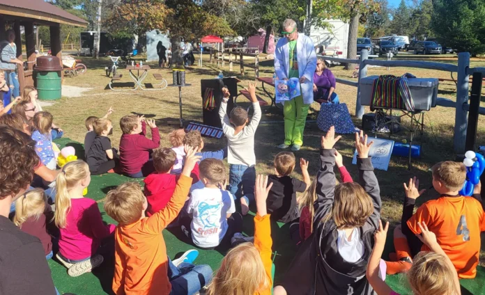 spookyscience-pic 1 Joel Tracy of TipTop Entertainment putting on a magic show. This was also funded by a grant awarded by the Community Foundation of NE Michigan to the Oscoda Co. District Library.