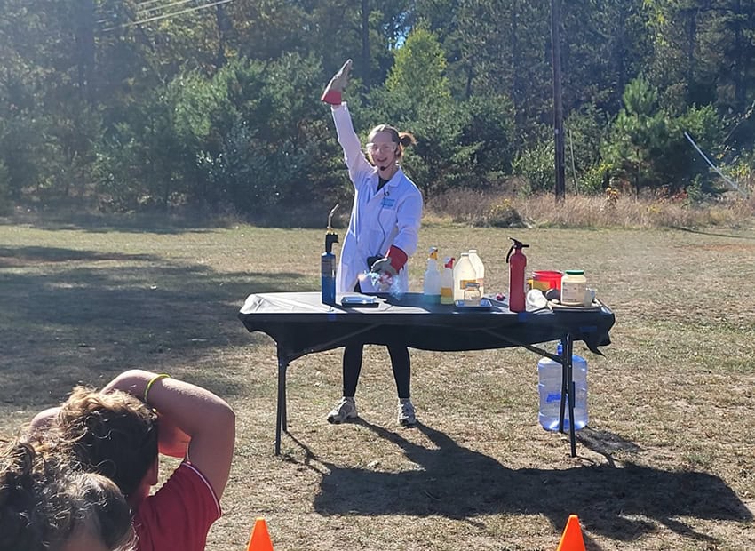 Demonstrating how friction causes a spark. This was the Kaboomistry Science Show, funded by a grant awarded by the Community Foundation of NE Michigan to the Oscoda Co. District Library.