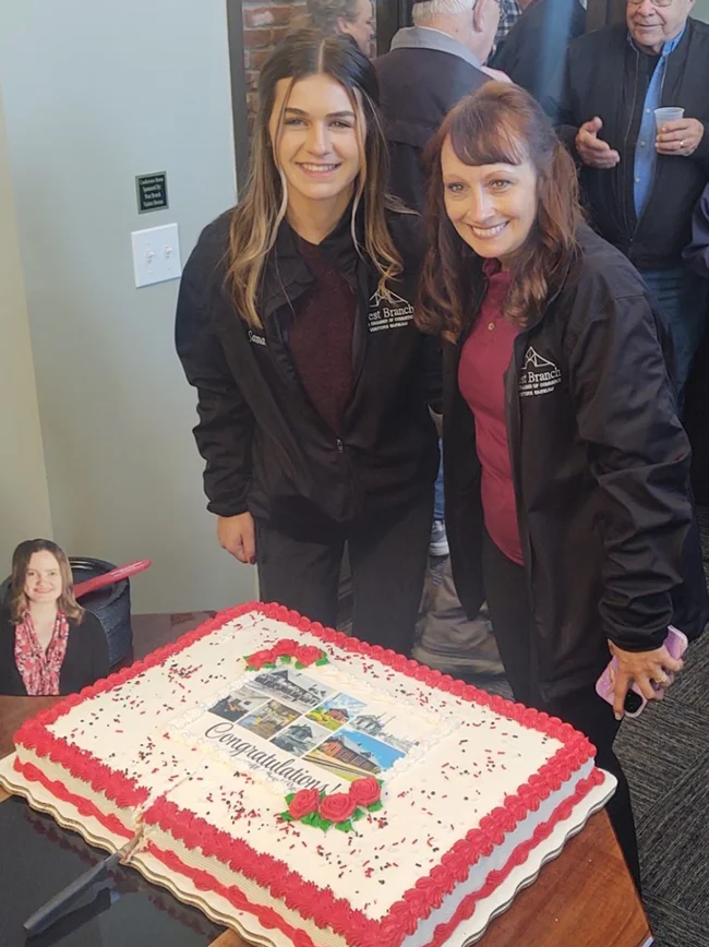 wb cake pic 3 The West Branch Chamber of Commerce held its Grand Opening of the historical railroad depot. Pictured are Chamber Director Samantha Defour and Heather Neuhaus.