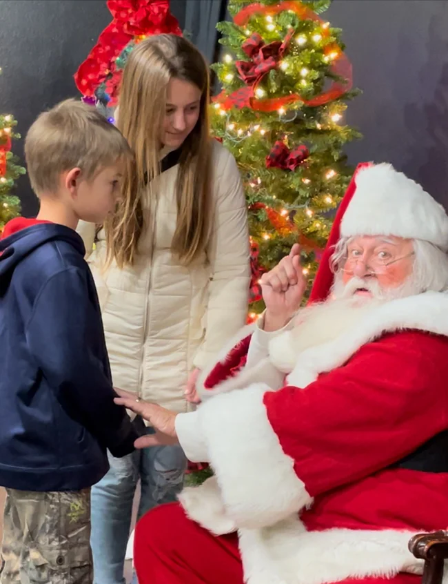 He’s always watching! Santa made his appearance at the Annual Grayling Christmas Walk.