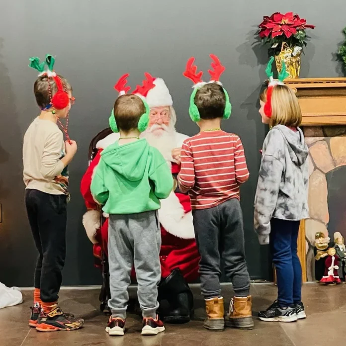 grayling walk-pic 4 Santa at the Artisan Village making sure kiddos have been nice!
