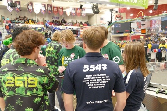 robotics The Talons Driver’s (Ellery Coleman & Liam Schalk-Smith) strategizing with qualification team members.