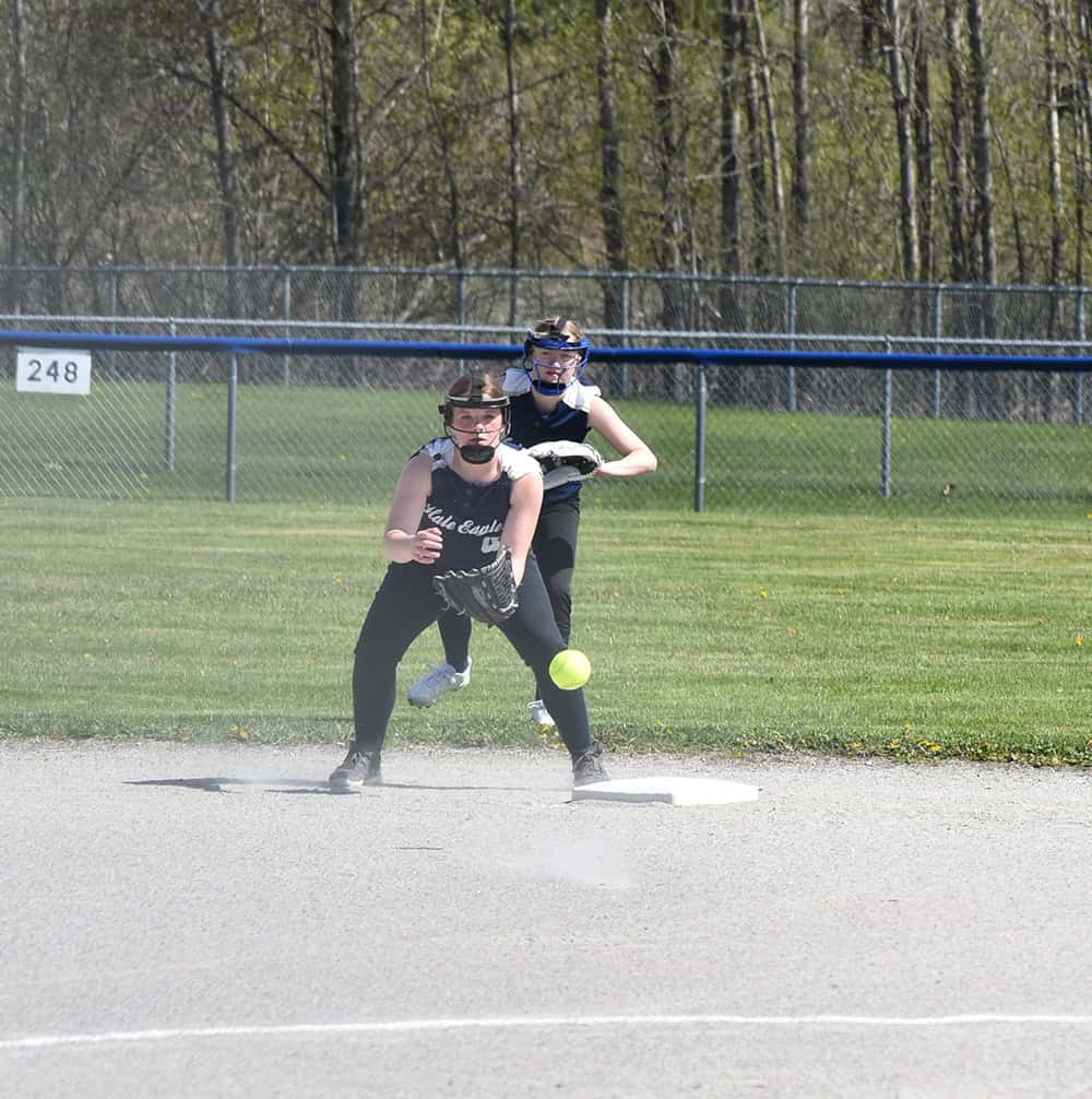 Hale softball player Callie Hick catches this throw from home. Alexis Cook backed her up.
