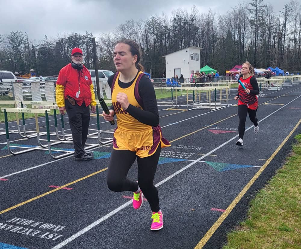 Fairview freshman Celia Miron competing in the 4x8 relay.