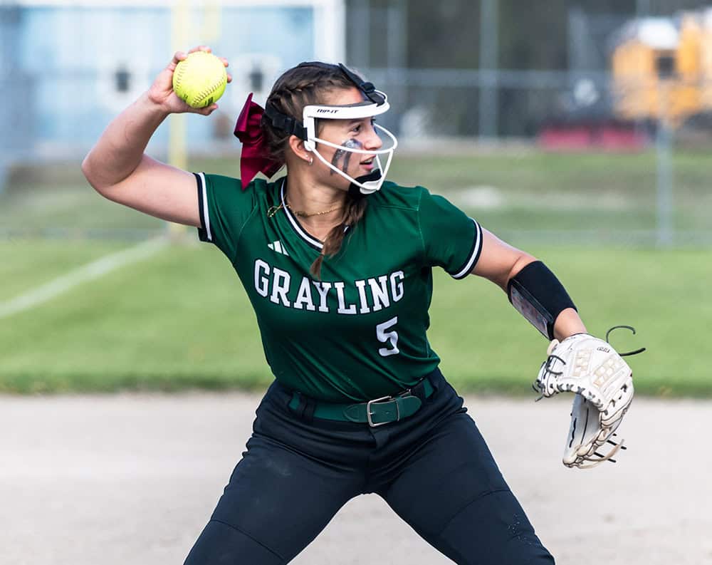 Grayling's Jessica Campbell mid play during a varsity softball game.