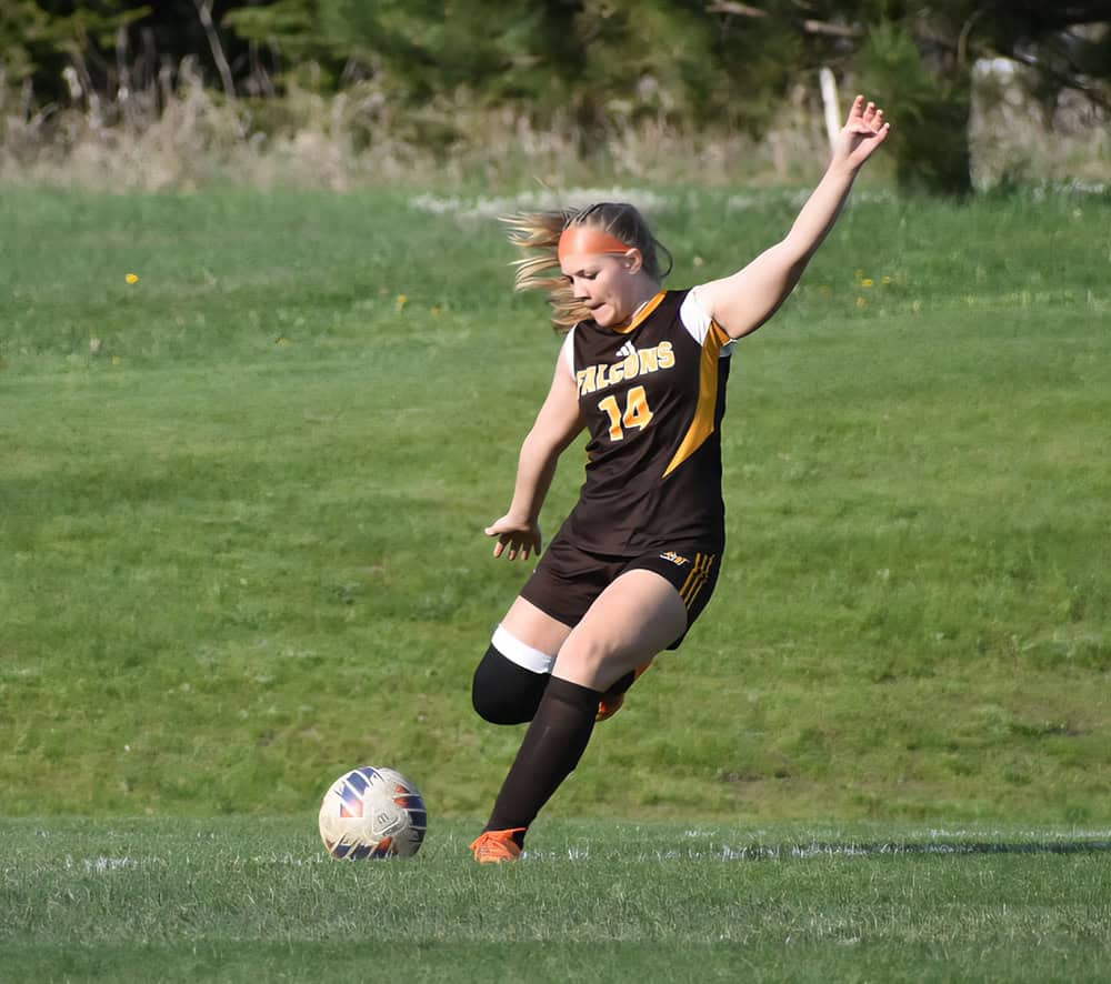 Bella Sikorski from Ogemaw Heights going for the sideline boot!