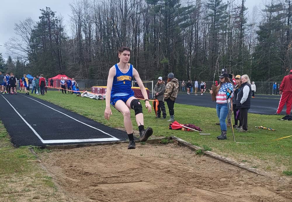 Mio freshman Scott Lawrence competing in the long jump.