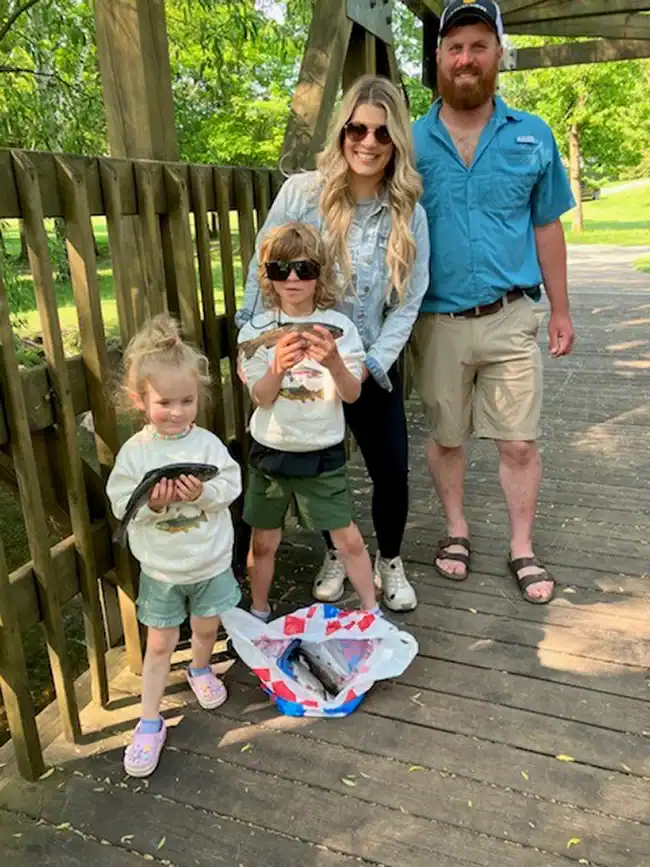 Kelsey and Mitch Poscal, from Merril MI., brought their girls, Wren (3) and Ames (7) to try their luck at catching a fish.