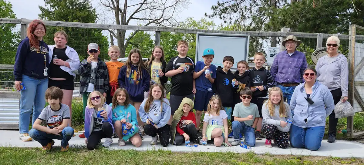 Mrs. Gonska’s 3rd grade class enjoys a treat with volunteers after an afternoon of planting at the Rosco Community Garden.