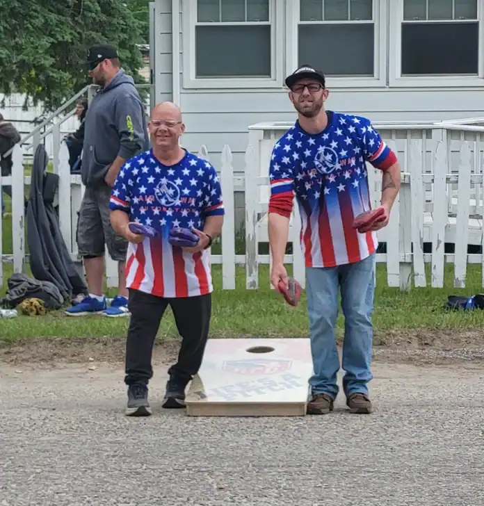 rwb pic 1 Grayling residents Nate Niederer and Cody Collen competing in the cornhole tournament.
