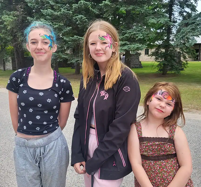 Stella Keister, Roselin Boutilier, and Lilly Schmitz showing off their painted faces.