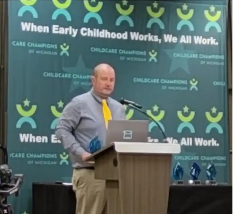 Dan O’Connor, Superintendent for Alcona Community Schools, accepts the award at the 2025 Childcare Champions event