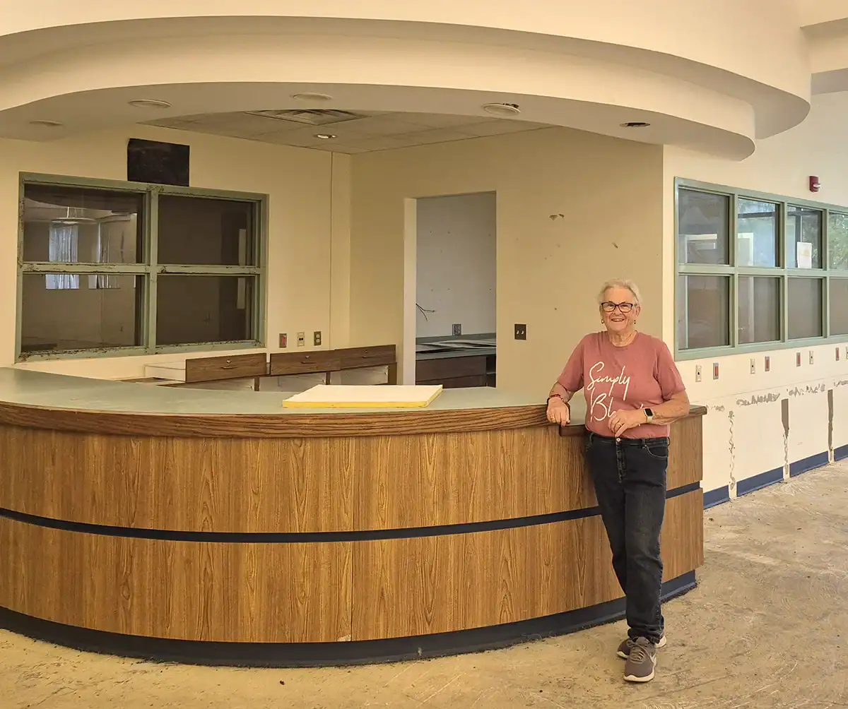 Chairman of the RCACC consortium board, Kathy Curtis standing at the future library front desk.