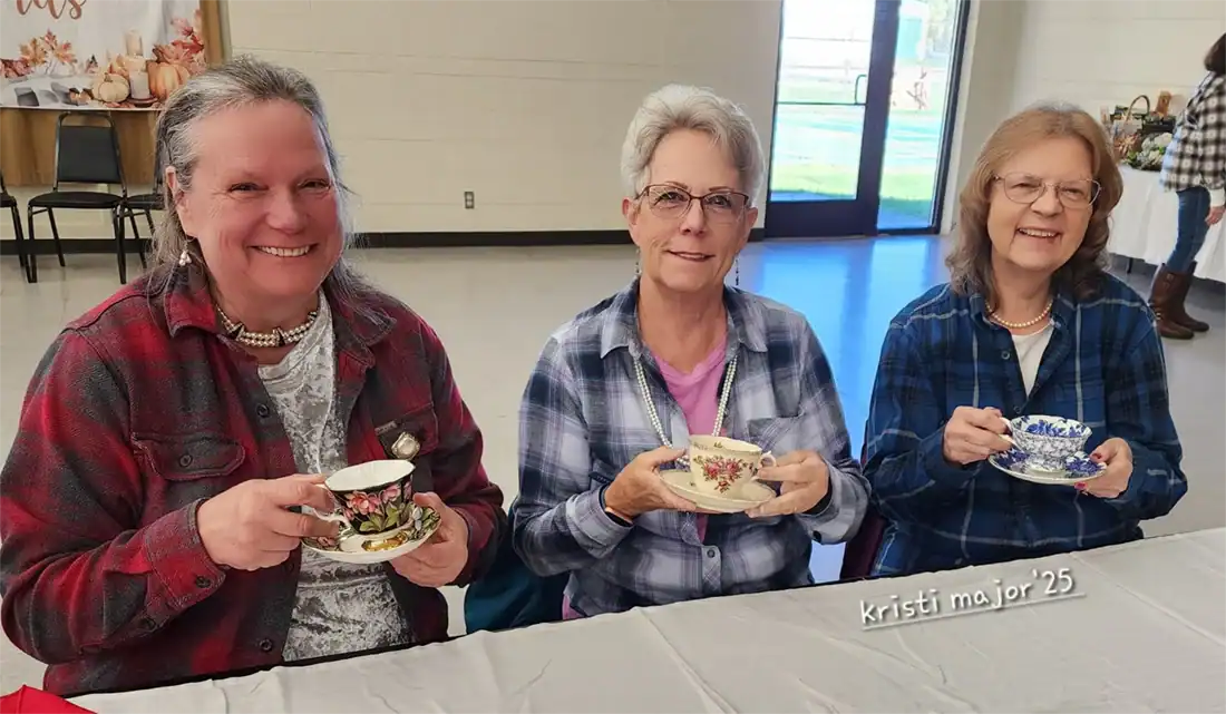 Guests were encouraged to bring their own teacup to use. Madonna Bernard (L), Jorayne Wyman (M) and Chris Nuttall (R) show off their plaid, pearls, and vintage teacups.