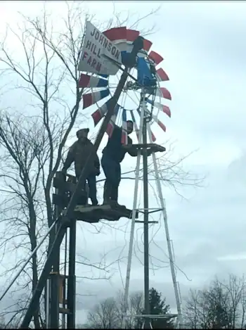 The family installed the newly painted windmill on their Curtis Road farm.