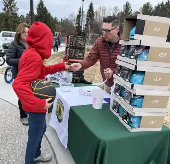 Jory Klumpp of the CRAF center oversaw a helmet raffle. Helmets donated by Northbound Outfitters of Grayling.