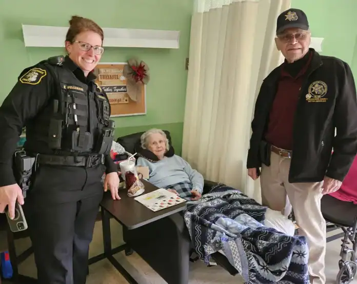 Victim Service Unit and Roscommon County Sheriff' Department deliver goodies to local nursing homes. Pictured is Roscommon County Sheriff's Deputy Emilie Pellerin and VSU member Ed Thoma dropping off treats.