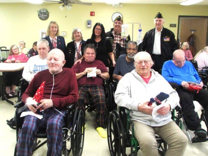 Pictured at Lakeview Manor; Back (l-r) Auxiliary Treasure, Linda Otey, Auxiliary Chaplain, Marlene Polishak, Lakeview Director, Mitzie Harmon, Legion Commander, John Memo, and Past Commander Chuck Carroll. Middle (l-r) Veterans Bill Mott, Lenny Stevenson, Jay Jolly, and Greg Stewart. Front (l-r) Tom Segar and Tom Hurd.